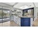Beautiful kitchen with a marble-styled island, stainless steel appliances, and a sliding door to the porch at 4206 Candler Ave, Spring Hill, FL 34609