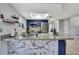 Bright kitchen with a marble-styled island, stainless steel appliances, and modern countertops at 4206 Candler Ave, Spring Hill, FL 34609