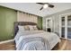 Spacious main bedroom with en suite bath, wood-look floors and closet with privacy doors at 4206 Candler Ave, Spring Hill, FL 34609