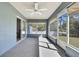 The spacious sunroom features sliding glass doors for easy access to the outdoors at 4206 Candler Ave, Spring Hill, FL 34609