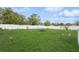 Lush green backyard with a tidy lawn, ideal for outdoor enjoyment and relaxation at 4544 Cynthia Ln, Spring Hill, FL 34606