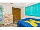Bedroom showcasing a dresser and closet with a bright window at 4544 Cynthia Ln, Spring Hill, FL 34606