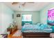 Bright bedroom with a ceiling fan and light blue painted walls at 4544 Cynthia Ln, Spring Hill, FL 34606