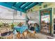 Relaxing enclosed porch with casual seating, offering a serene and private outdoor space at 4544 Cynthia Ln, Spring Hill, FL 34606