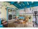 Outdoor Florida room with a ceiling fan and an exercise machine at 4544 Cynthia Ln, Spring Hill, FL 34606