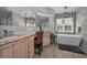 This bathroom features a soaking tub, marble tile, and vanity with leather chair at 494 Village Dr, Tarpon Springs, FL 34689