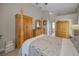 This bedroom features a four poster bed, wood floors, and plenty of storage space at 494 Village Dr, Tarpon Springs, FL 34689
