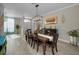 This dining room features wood floors and a buffet with decorative accents at 494 Village Dr, Tarpon Springs, FL 34689