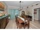 This dining room features wood floors, decorative accents, and large wood table at 494 Village Dr, Tarpon Springs, FL 34689