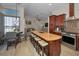 This gourmet kitchen has stainless steel appliances and counter seating for four at 494 Village Dr, Tarpon Springs, FL 34689