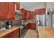 This gourmet kitchen has stainless steel appliances, gas range and wood floors at 494 Village Dr, Tarpon Springs, FL 34689