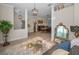 Open-concept living space with stylish furnishings and ample natural light, leading to the dining area at 494 Village Dr, Tarpon Springs, FL 34689