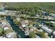 Aerial view of canal-front homes, showcasing the community's waterfront lifestyle and natural surroundings at 5319 Ray Dr, Weeki Wachee, FL 34607