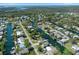 Panoramic aerial shot of waterfront community, featuring canals, lush greenery, and tranquil waterways at 5319 Ray Dr, Weeki Wachee, FL 34607