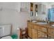 Bathroom featuring a wood vanity and plenty of open shelving at 5319 Ray Dr, Weeki Wachee, FL 34607