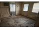 An aged bedroom featuring two windows at 5319 Ray Dr, Weeki Wachee, FL 34607