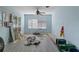 Living room showing signs of disrepair with exposed flooring, disorganized items, and weathered walls, indicating renovation needs at 5319 Ray Dr, Weeki Wachee, FL 34607