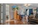 Bright living room with wood floors, TV, and easy access to the kitchen at 5319 Ray Dr, Weeki Wachee, FL 34607