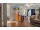 Spacious living room with wood floors, adjacent to kitchen, perfect for entertaining at 5319 Ray Dr, Weeki Wachee, FL 34607