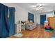 Cozy living room with a recliner and blue curtains for a relaxing atmosphere at 5319 Ray Dr, Weeki Wachee, FL 34607