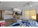 Living space and kitchen needing renovation and repair with bright light coming from the windows at 5319 Ray Dr, Weeki Wachee, FL 34607
