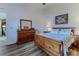 This main bedroom features hardwood floors and plenty of space at 6036 Dorset Rd, Spring Hill, FL 34608