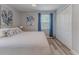 Relaxing bedroom features a plush bed, blue accents, ample closet space, and natural light at 6183 Waverly Rd, Weeki Wachee, FL 34607