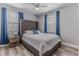 Comfortable bedroom with neutral walls, a large bed, and a ceiling fan at 6183 Waverly Rd, Weeki Wachee, FL 34607