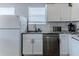 Well-equipped kitchen with stainless steel appliances, granite countertops, and white cabinets for a clean, modern look at 6183 Waverly Rd, Weeki Wachee, FL 34607