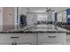 Stylish kitchen features sleek countertops, stainless steel appliances, and opens up to the spacious living area at 6183 Waverly Rd, Weeki Wachee, FL 34607