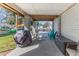 Covered outdoor patio with furniture and a grill at 6183 Waverly Rd, Weeki Wachee, FL 34607
