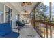 Spacious screened porch with comfortable seating, ceiling fans, offering views of a lush, green yard at 6183 Waverly Rd, Weeki Wachee, FL 34607