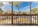 Screened-in porch offering tranquil views of the canal, lush greenery, and waterfront homes at 6183 Waverly Rd, Weeki Wachee, FL 34607