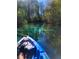 Scenic view of blue kayak on clear river surrounded by green trees at 6183 Waverly Rd, Weeki Wachee, FL 34607