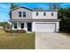 Charming two-story home with a two car garage and lovely landscaping at 6209 Radford St, Spring Hill, FL 34606