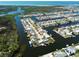 Stunning aerial of waterfront homes with boat docks, surrounded by canals and green spaces at 6627 Leeside Isle, Hudson, FL 34667