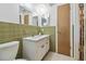 This charming bathroom features a tiled shower and vanity with a sink and mirror at 6627 Leeside Isle, Hudson, FL 34667