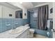Bathroom featuring tiled shower and vanity with sink and mirror at 6627 Leeside Isle, Hudson, FL 34667