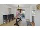 Traditional dining room with a dark wood table, seating for four, and sliding glass doors to the outside at 6627 Leeside Isle, Hudson, FL 34667