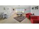 Inviting living room featuring ample seating, warm lighting, and an open layout at 6627 Leeside Isle, Hudson, FL 34667