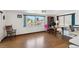 Bright living room features views of the water, wood laminate flooring, and office space at 6627 Leeside Isle, Hudson, FL 34667