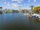 Waterfront view of a canal, homes, docks, and boats at 6627 Leeside Isle, Hudson, FL 34667