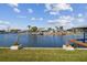 Scenic waterfront view with boat lifts, docks, and charming homes along the water at 6627 Leeside Isle, Hudson, FL 34667