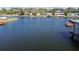 A waterfront view of a canal featuring calm water and neighborhood homes at 6627 Leeside Isle, Hudson, FL 34667