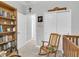A cozy bedroom featuring a wooden rocking chair and a bookcase filled with reading material at 6741 Citrus Creek Ln, Tampa, FL 33625