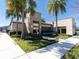 Exterior view of a well-maintained community clubhouse with attractive landscaping and sidewalks at 6741 Citrus Creek Ln, Tampa, FL 33625