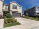 Charming two-story home with a two-car garage and a beautifully landscaped front yard at 6741 Citrus Creek Ln, Tampa, FL 33625