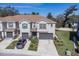 Charming townhome with a two-car garage and landscaped front yard at 6741 Citrus Creek Ln, Tampa, FL 33625