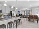 Open-concept kitchen with center island, eating area, and living area at 6741 Citrus Creek Ln, Tampa, FL 33625