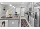 Modern kitchen with a center island, granite counters, and stainless appliances at 6741 Citrus Creek Ln, Tampa, FL 33625